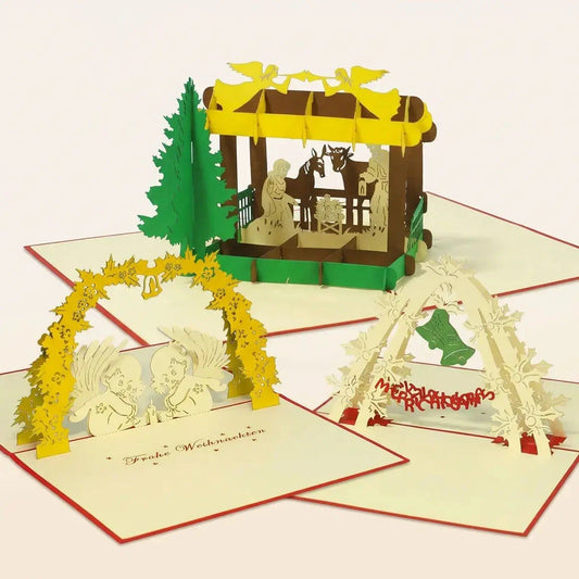 Drei offene Pop-Up-Weihnachtskarten mit Weihnachtskrippe, Engeln unter einem gelben Bogen und grünen Weihnachtsglocken