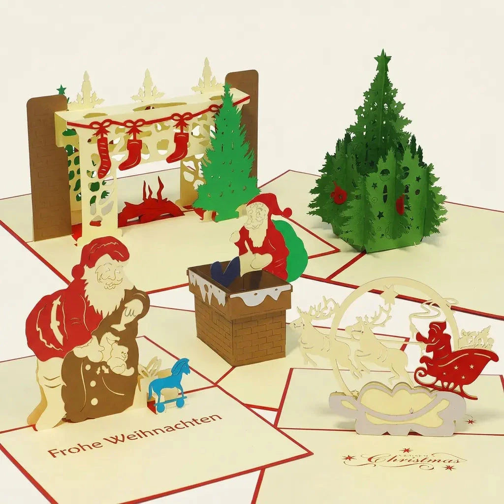 Fünf geöffnete LINPopUp Pop-Up-Weihnachtskarten im Set Bescherungszauber: Weihnachtskamin, Weihnachtsmann mit Gabensack, Weihnachtsmann im Schornstein, Rentierschlitten und grüner Weihnachtsbaum