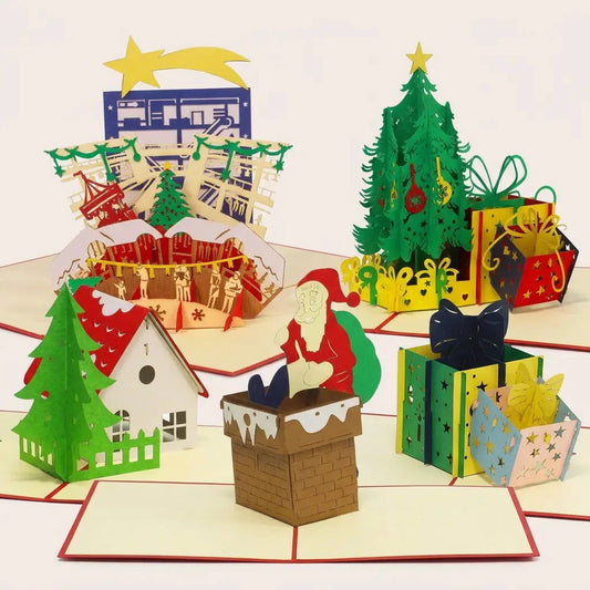 Fünf geöffnete LINPopUp Pop-Up-Weihnachtskarten im Set Weihnachtsabend: Weihnachtsmarkt, Weihnachtshaus, Weihnachtsmann im Schornstein, Geschenke und Weihnachtsbaum mit Geschenken
