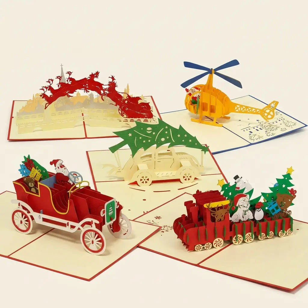 Fünf geöffnete LINPopUp 3D Pop-Up-Weihnachtskarten im Set Weihnachtsreise: gelber Helikopter, roter Oldtimer, Weihnachtszug, Auto mit Tannenbaum und Weihnachtsmann über der Stadt