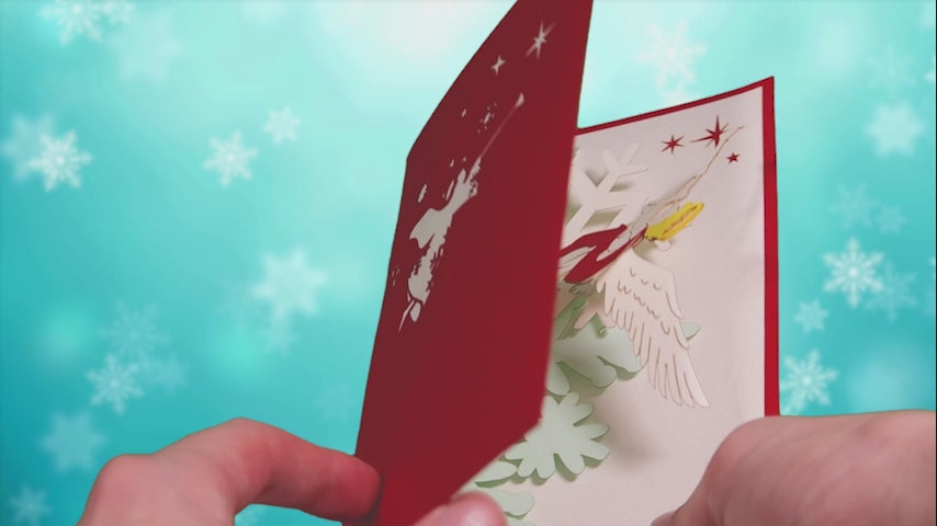 Video laden: Die 3D-Weihnachtskarte mit Christkind-Engel wird geöffnet und wieder geschlossen; dabei dreht sich das Engelmotiv.